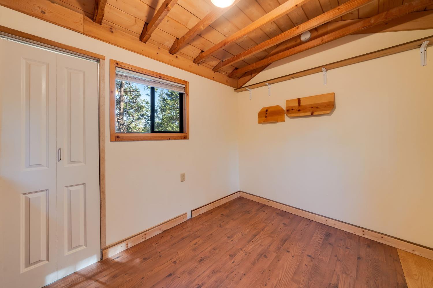 6139 Shad Way Pollock Pines, CA 95726 - Photo 38 of 49 a view of a room with wooden floor and a window