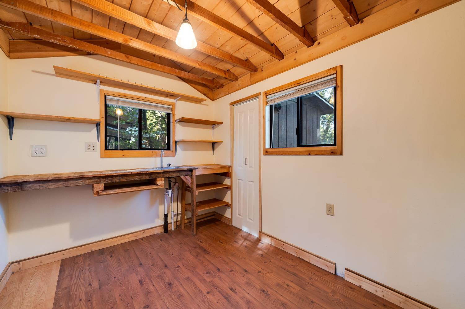 6139 Shad Way Pollock Pines, CA 95726 - Photo 40 of 49 a room with wooden floors and a window