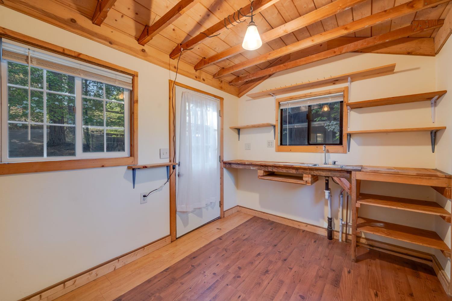 6139 Shad Way Pollock Pines, CA 95726 - Photo 41 of 49 a view of a kitchen with a refrigerator and wooden floor