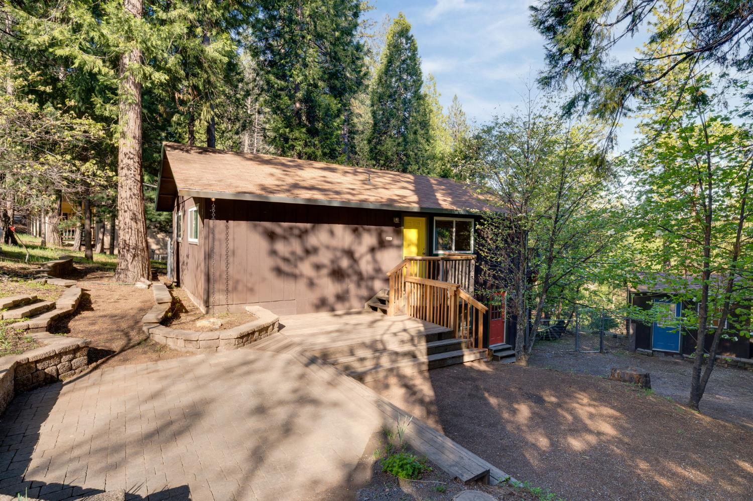 6139 Shad Way Pollock Pines, CA 95726 - Photo 49 of 49 a view of a patio with table and chairs with wooden fence and plants