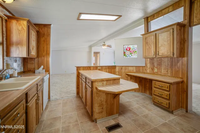a kitchen with a sink a stove and a refrigerator