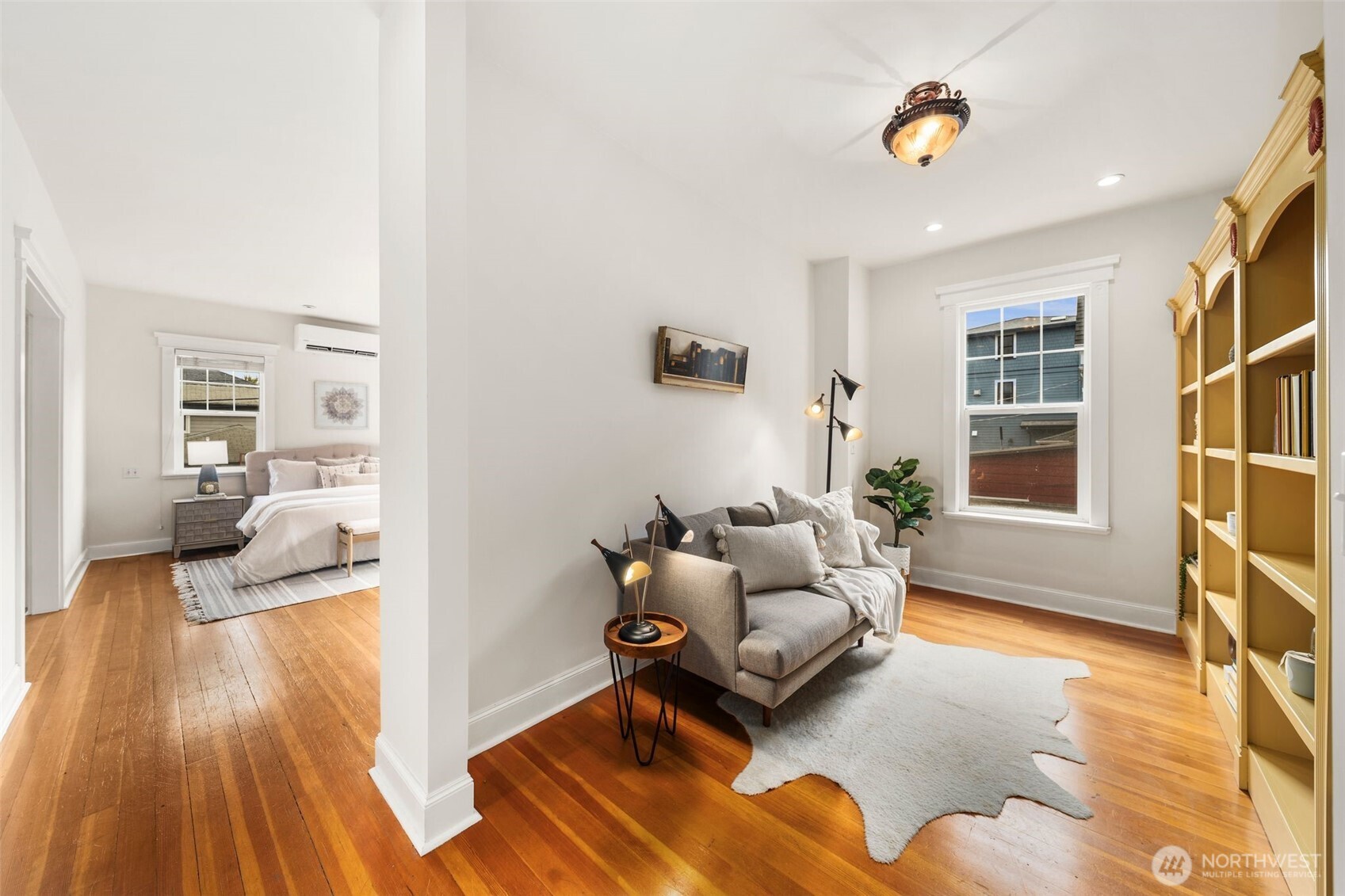 2446 Queen Anne Avenue North Seattle, WA 98109 - Photo 17 of 40 a living room with furniture and a wooden floor