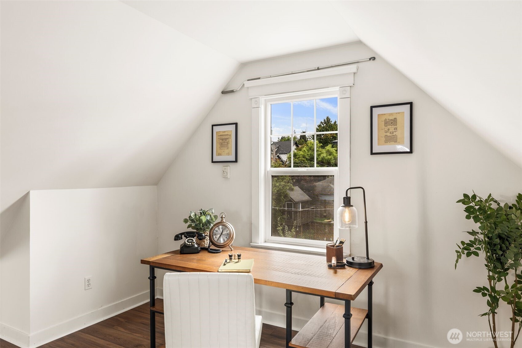 2446 Queen Anne Avenue North Seattle, WA 98109 - Photo 27 of 40 a living room with furniture and a potted plant