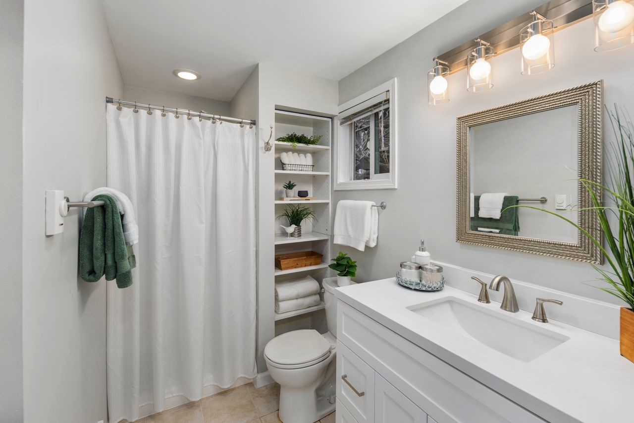 2446 Queen Anne Avenue North Seattle, WA 98109 - Photo 36 of 40 a bathroom with a sink toilet and shower