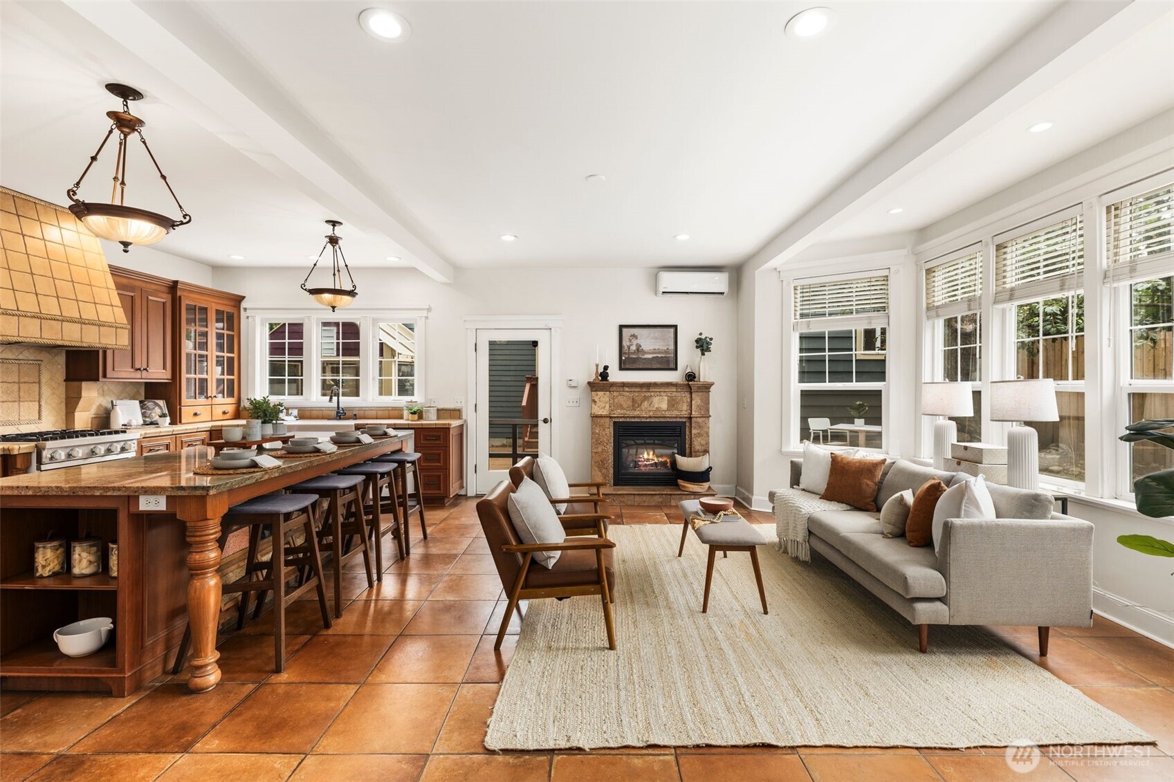 2446 Queen Anne Avenue North Seattle, WA 98109 - Photo 6 of 40 a living room with lots of furniture and a fireplace