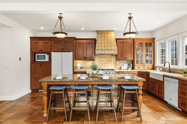 a kitchen with a table and chairs in it