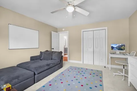 a bedroom with bed and a potted plant