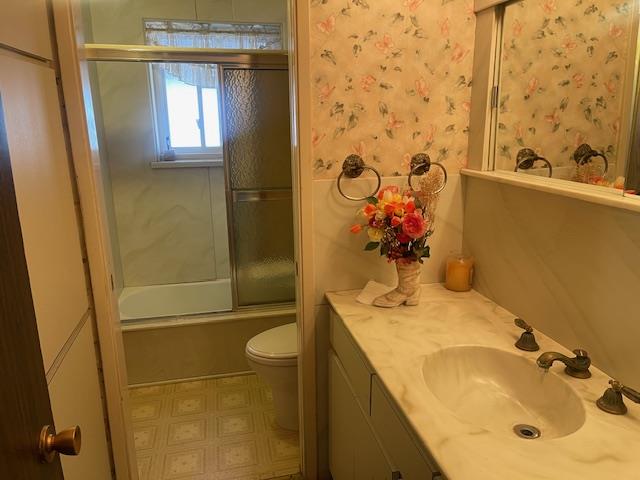 580 Cascade Drive Sunnyvale, CA 94087 - Photo 9 of 12 a bathroom with a granite countertop sink a mirror and shower