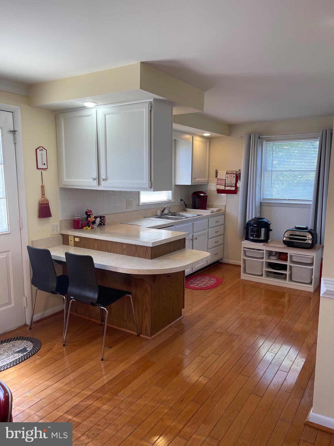 99 Exeter Court Shepherdstown, WV 25443 - Photo 11 of 51 a living room with stainless steel appliances granite countertop furniture and wooden floor