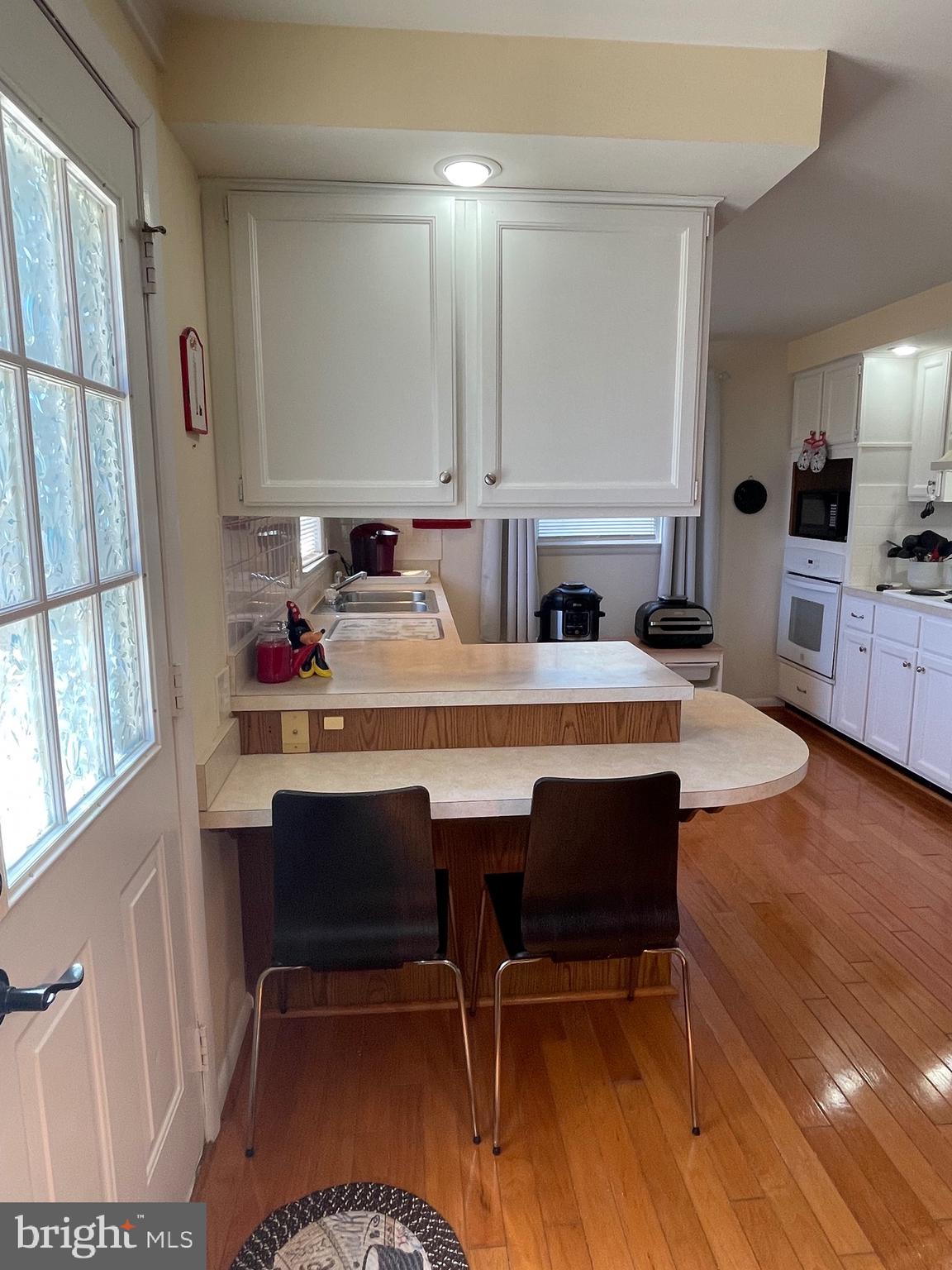 99 Exeter Court Shepherdstown, WV 25443 - Photo 12 of 51 a room with dining table and chairs