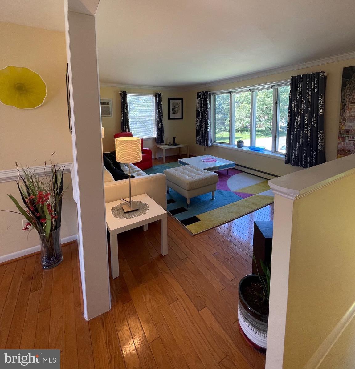 99 Exeter Court Shepherdstown, WV 25443 - Photo 14 of 51 a living room with furniture and a wooden floor