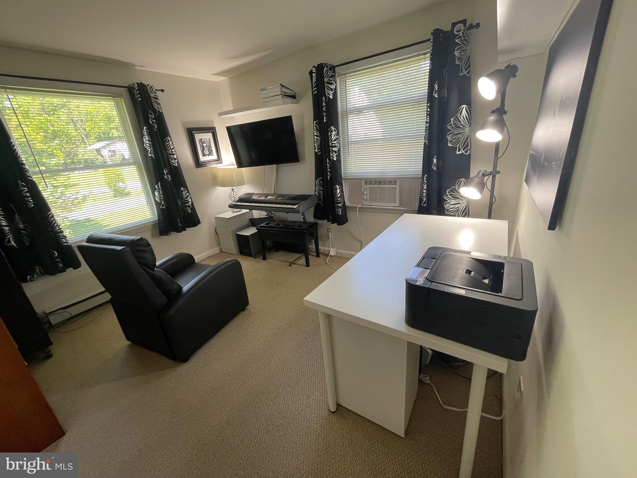 99 Exeter Court Shepherdstown, WV 25443 - Photo 25 of 51 a living room with furniture and a flat screen tv