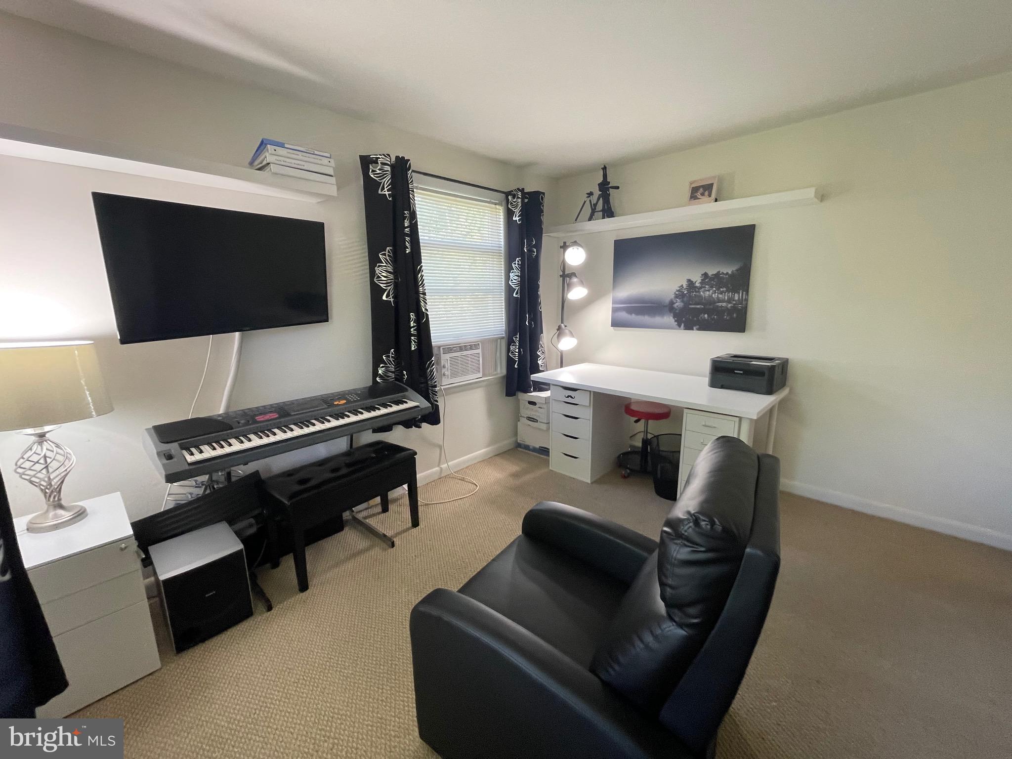 99 Exeter Court Shepherdstown, WV 25443 - Photo 26 of 51 a living room with furniture and a flat screen tv