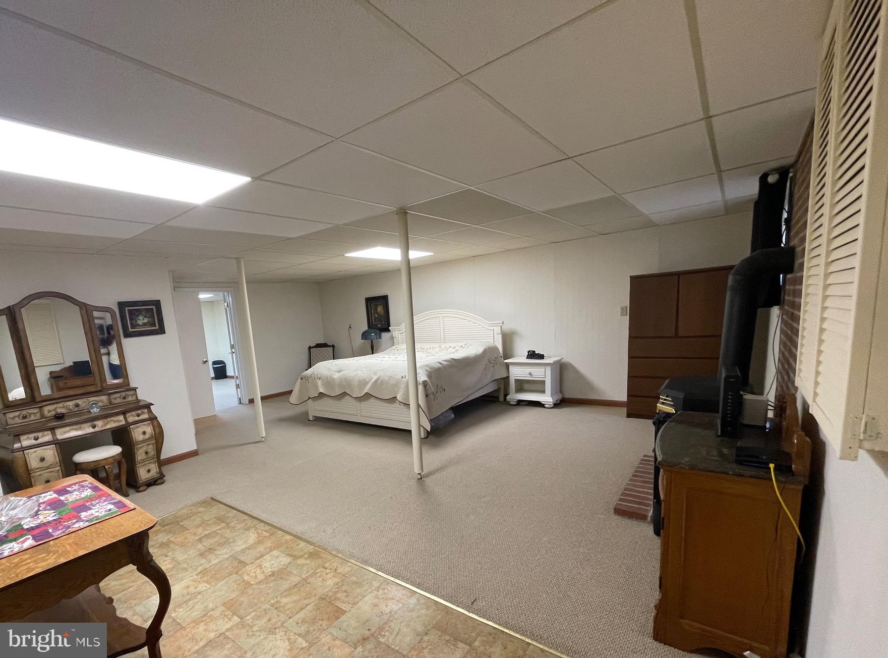 99 Exeter Court Shepherdstown, WV 25443 - Photo 32 of 51 a bedroom with bed and a couch