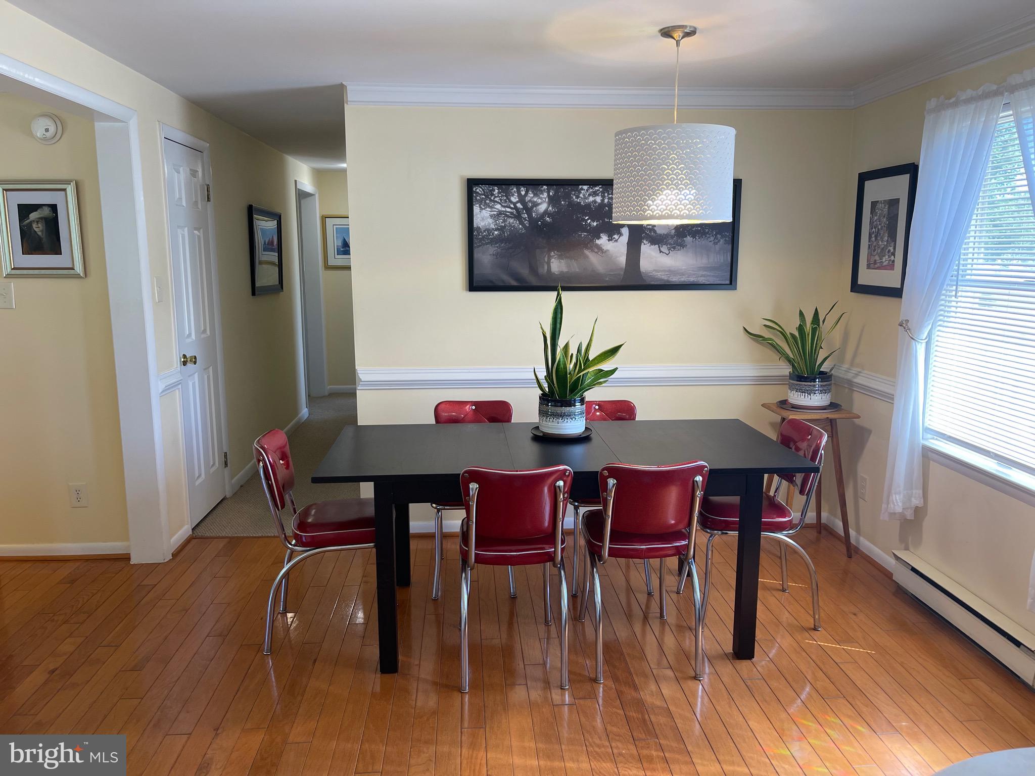 99 Exeter Court Shepherdstown, WV 25443 - Photo 4 of 51 a view of a dining room with furniture and wooden floor