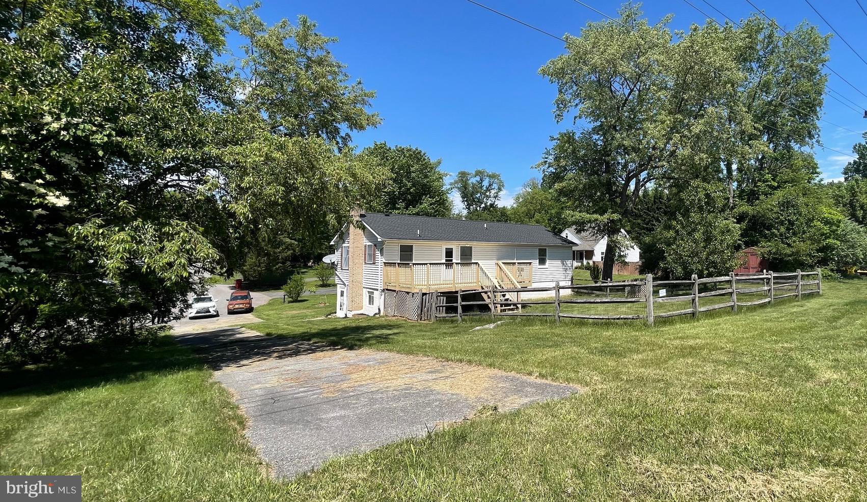 99 Exeter Court Shepherdstown, WV 25443 - Photo 42 of 51 a view of a house with a big yard potted plants and large tree
