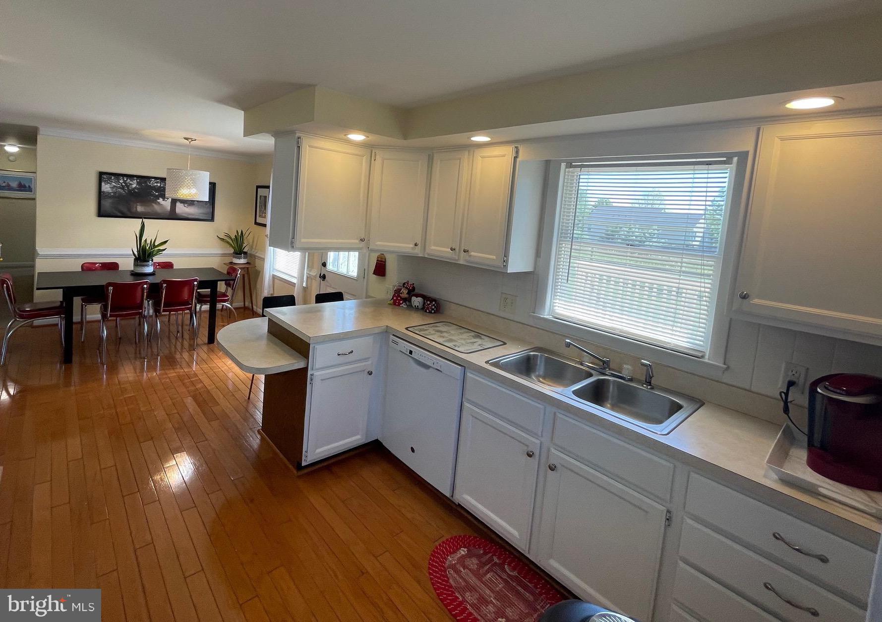 99 Exeter Court Shepherdstown, WV 25443 - Photo 7 of 51 a kitchen that has a lot of cabinets a sink and appliances in it