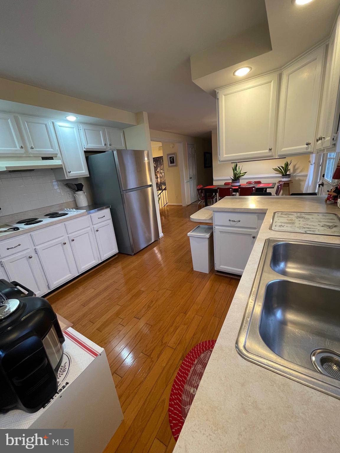 99 Exeter Court Shepherdstown, WV 25443 - Photo 8 of 51 a kitchen with sink refrigerator and stove