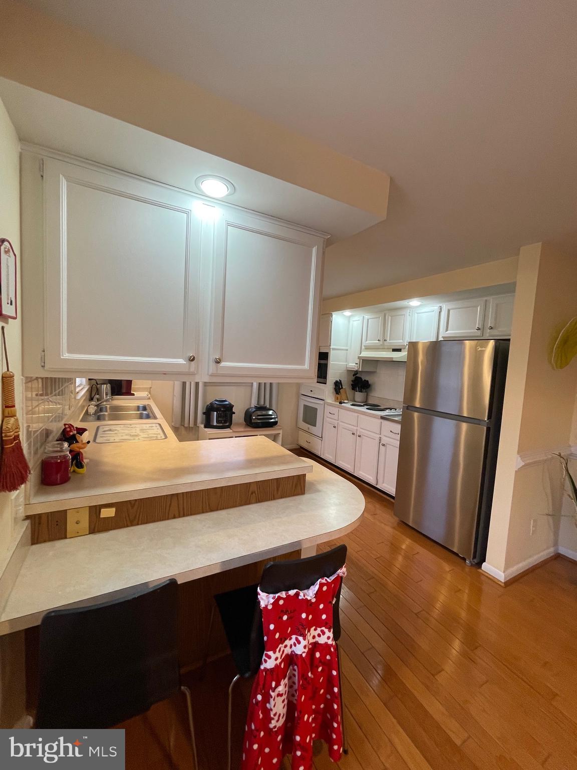 99 Exeter Court Shepherdstown, WV 25443 - Photo 9 of 51 a kitchen with refrigerator a sink and a stove