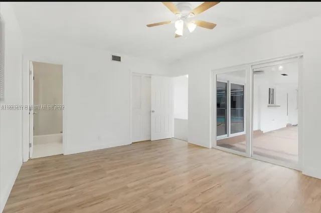 a view of an empty room with a bathroom