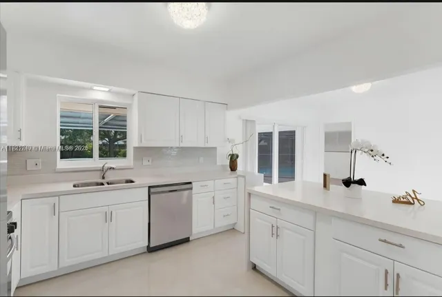 a kitchen with sink and window