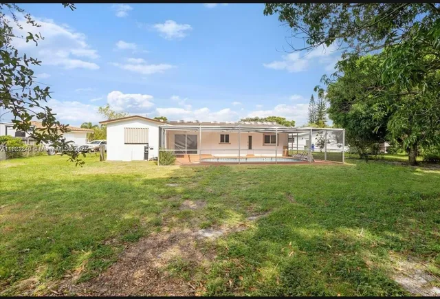 a view of a house with a big yard