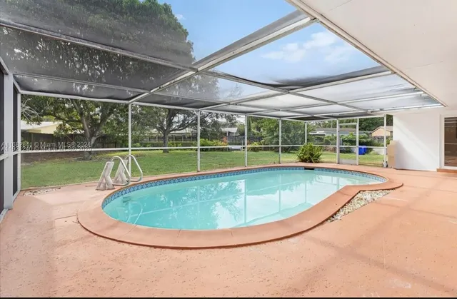 a view of a swimming pool with an outdoor space