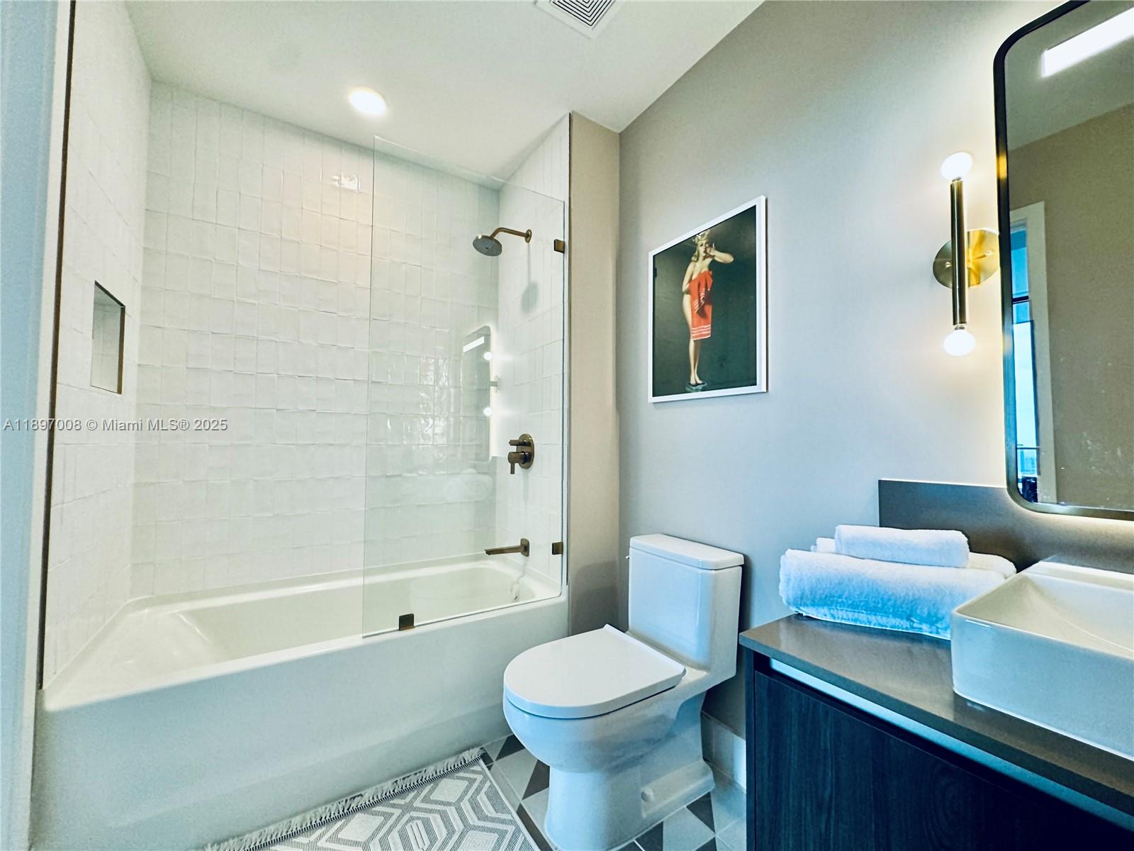159 Northeast 6th Street, Unit 4807 Miami, FL 33132 - Photo 35 of 63 a bathroom with a toilet sink and bathtub