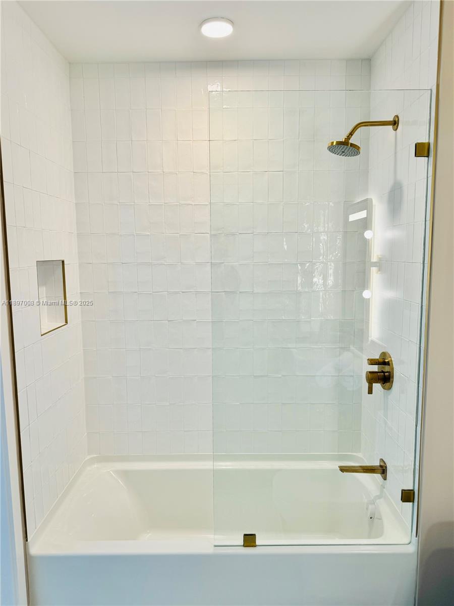 159 Northeast 6th Street, Unit 4807 Miami, FL 33132 - Photo 36 of 63 a bathroom with a bathtub