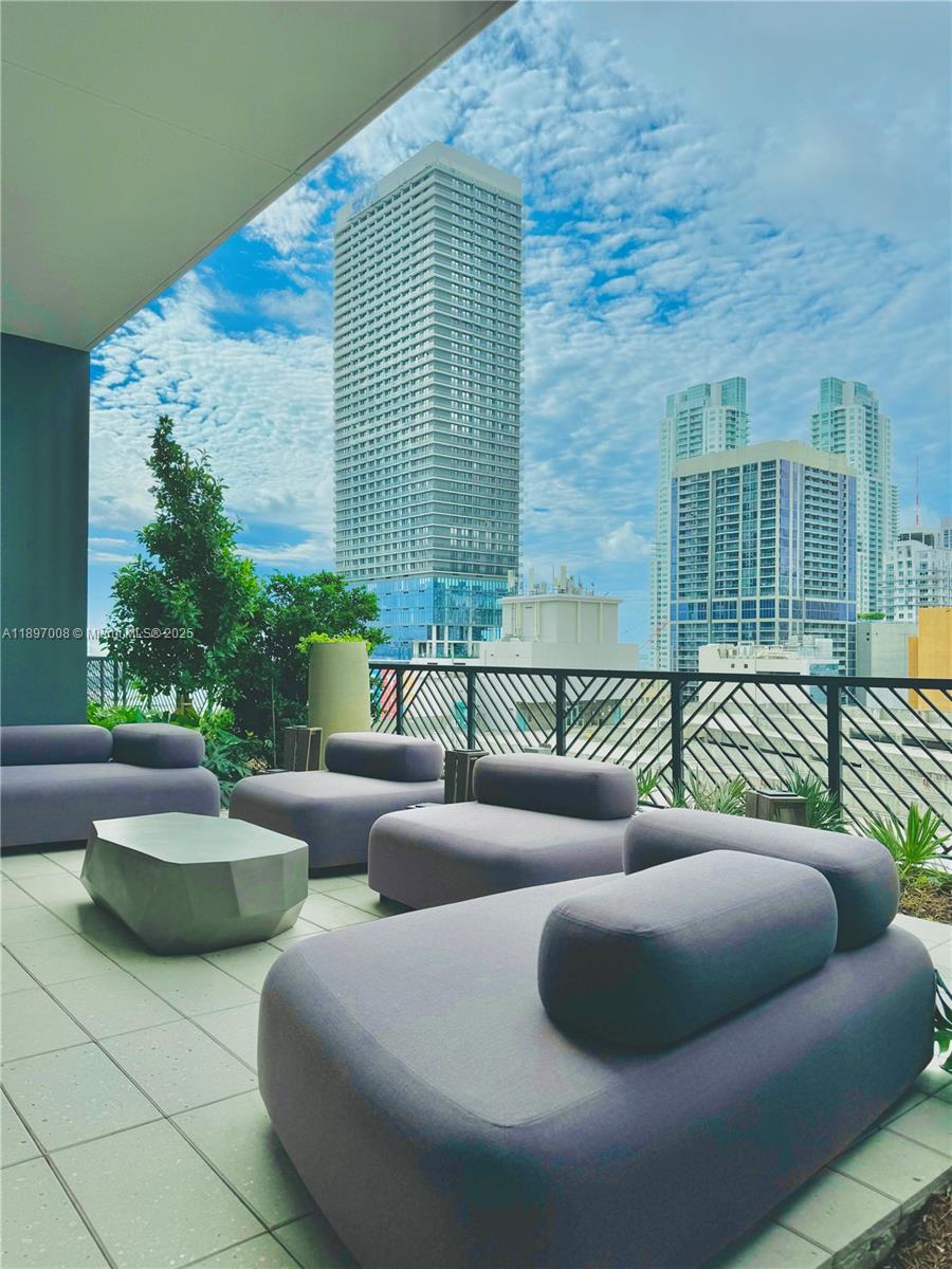 159 Northeast 6th Street, Unit 4807 Miami, FL 33132 - Photo 50 of 63 a outdoor living space with furniture and a potted plant