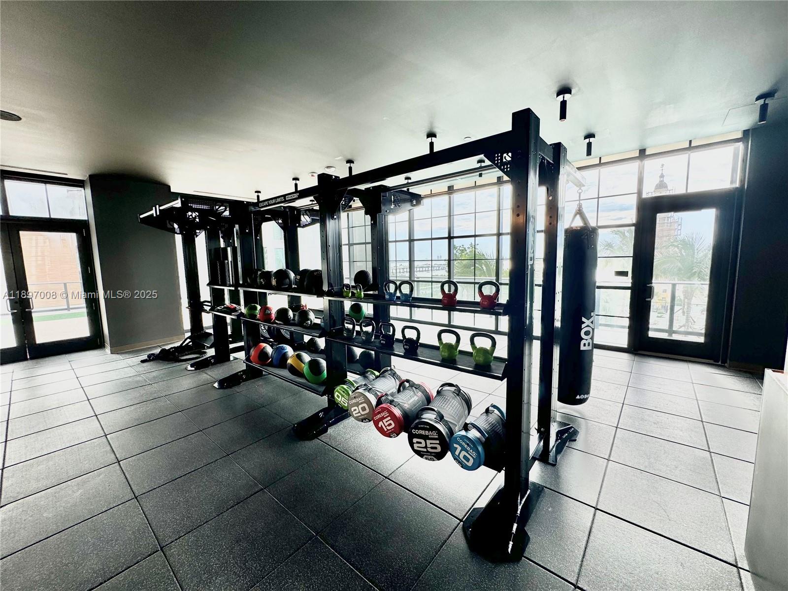 159 Northeast 6th Street, Unit 4807 Miami, FL 33132 - Photo 53 of 63 a view of a room with gym equipment