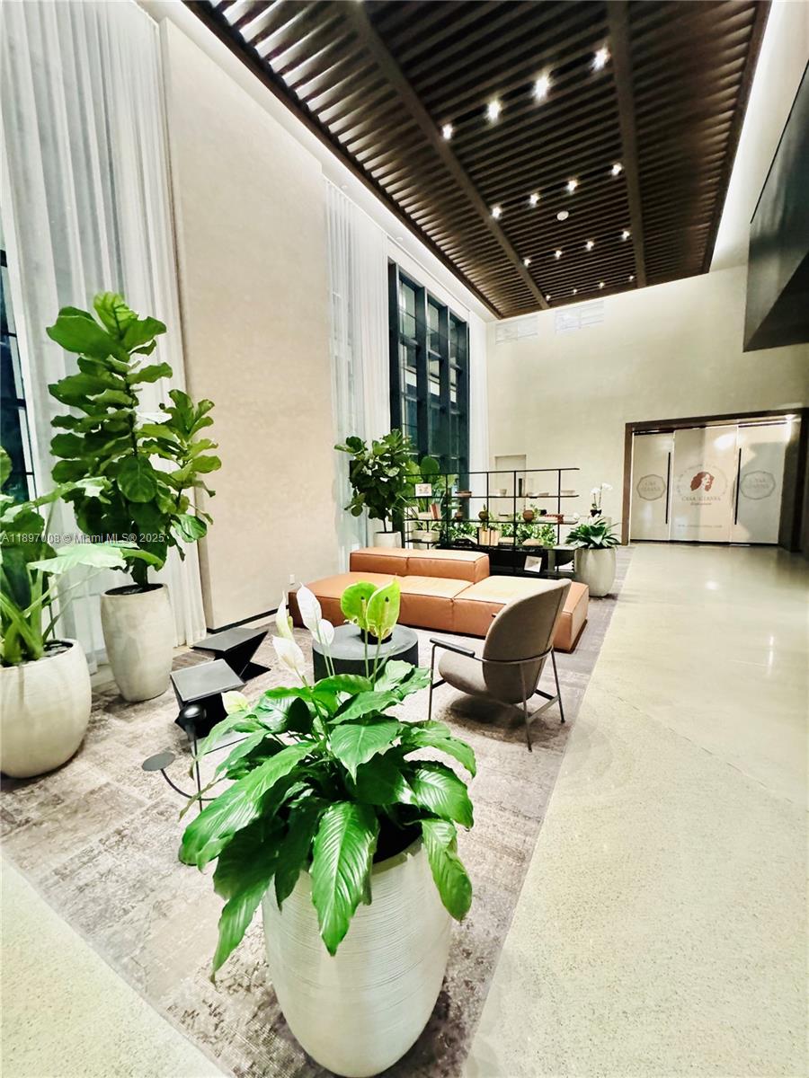 159 Northeast 6th Street, Unit 4807 Miami, FL 33132 - Photo 60 of 63 a swimming pool with potted plants