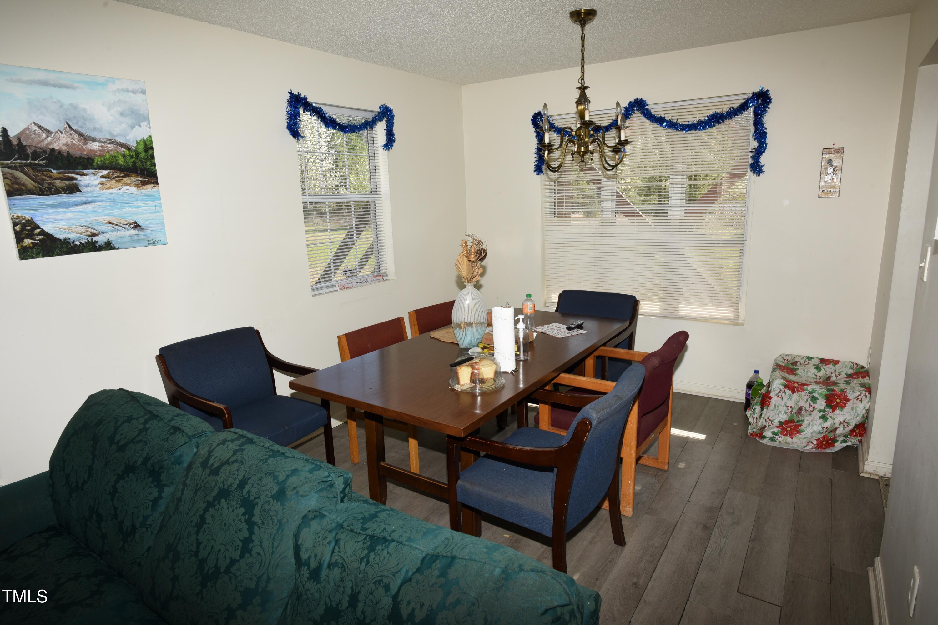 2913 Wadsworth Avenue Durham, NC 27707 - Photo 11 of 15 a view of a dining room with furniture and wooden floor