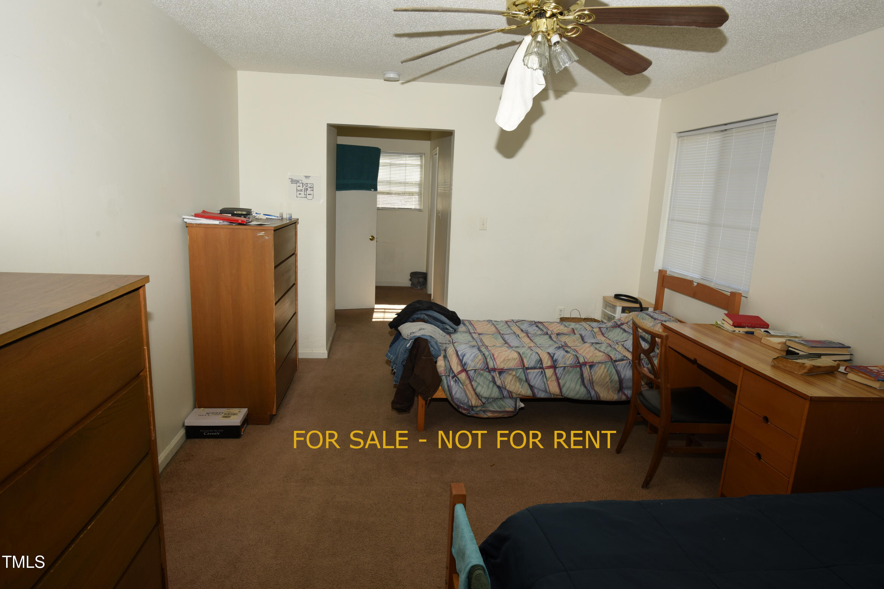 2913 Wadsworth Avenue Durham, NC 27707 - Photo 14 of 15 a bedroom with a bed and a chandelier