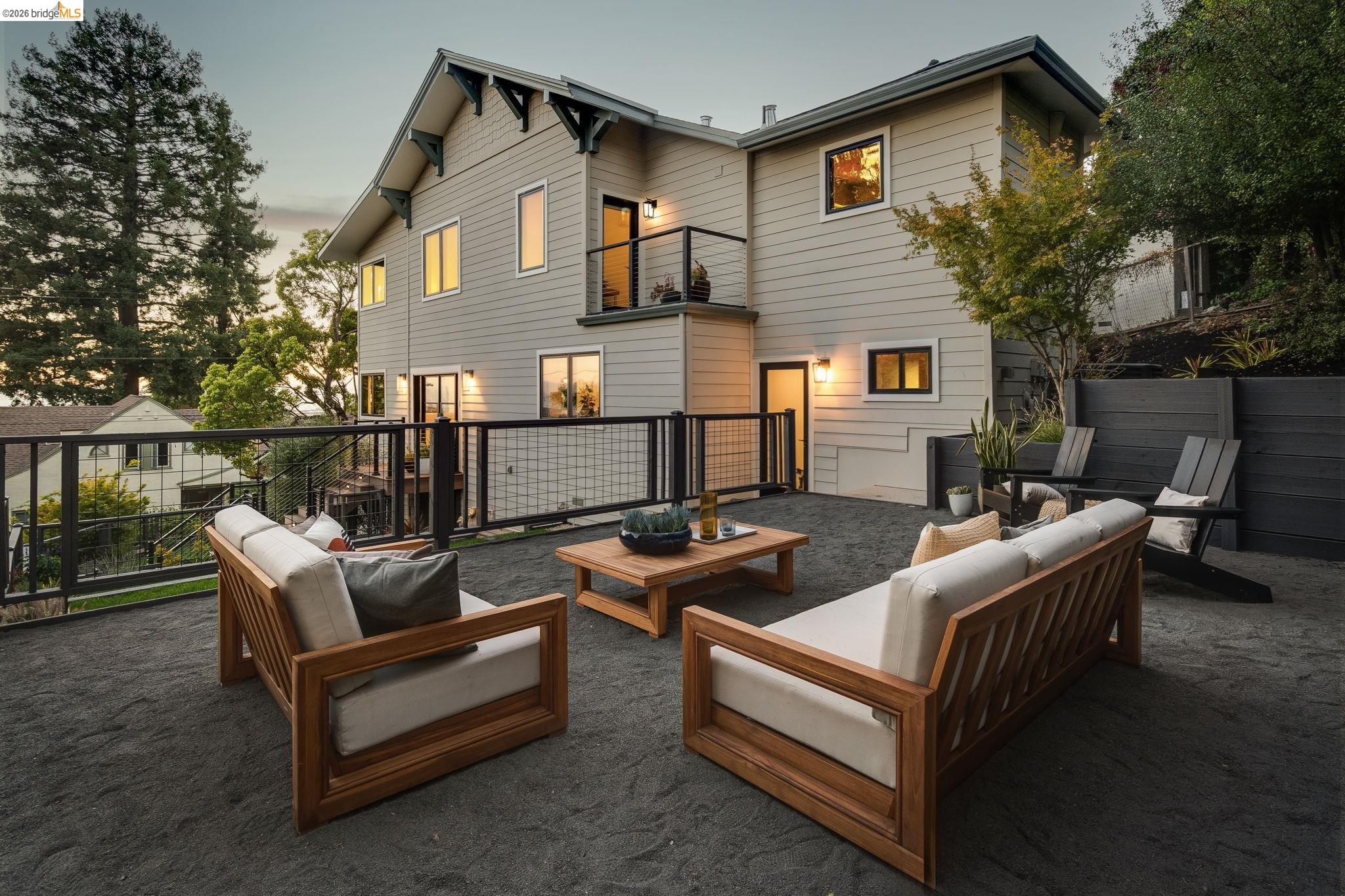 1409 Scenic Avenue Berkeley, CA 94708 - Photo 13 of 28 Rear exterior with light gray horizontal siding and black-framed windows
