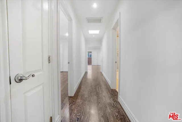 a bathroom with a toilet a sink a shower and mirror