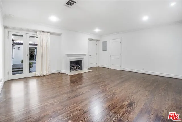 a bathroom with a granite countertop sink and a large mirror