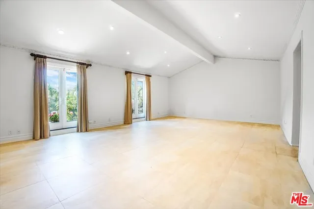 a kitchen with stainless steel appliances granite countertop a sink and a stove