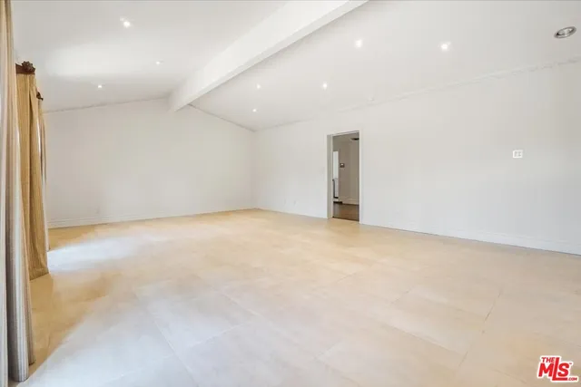 a kitchen with stainless steel appliances granite countertop a sink and a refrigerator