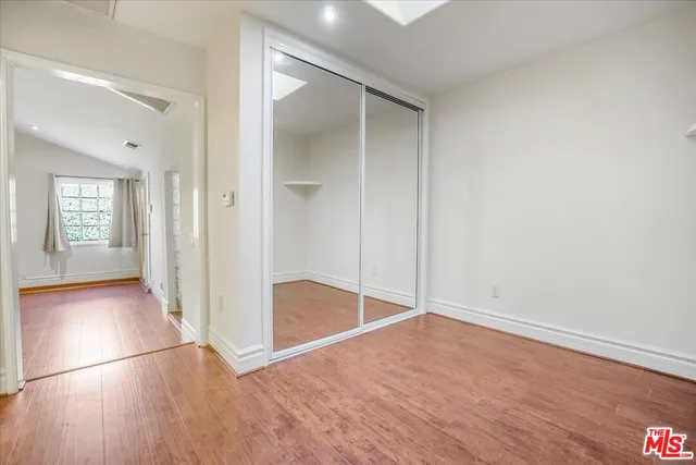 a front view of house with yard and trees