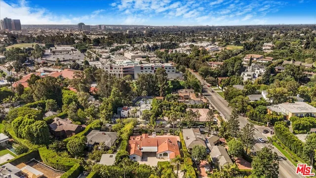 an aerial view of house with yard