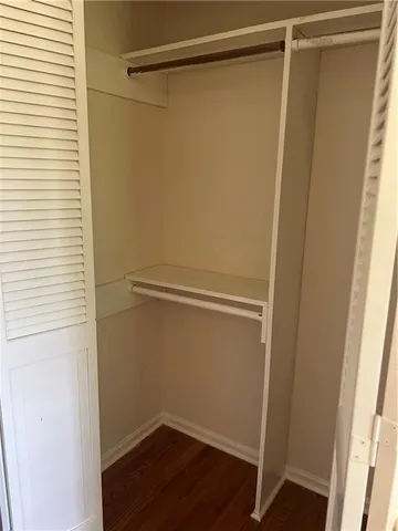a bathroom with a white bath tub a sink and a toilet
