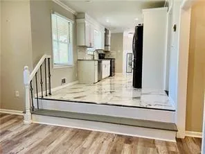 a view of a kitchen from the hallway