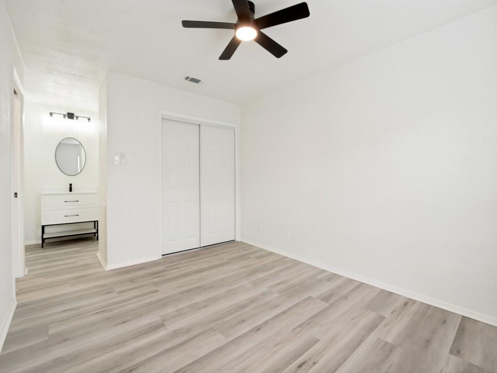 2240 Tarpley Road, Unit 92 Carrollton, TX 75006 - Photo 16 of 22 a view of a room with wooden floor and mirror