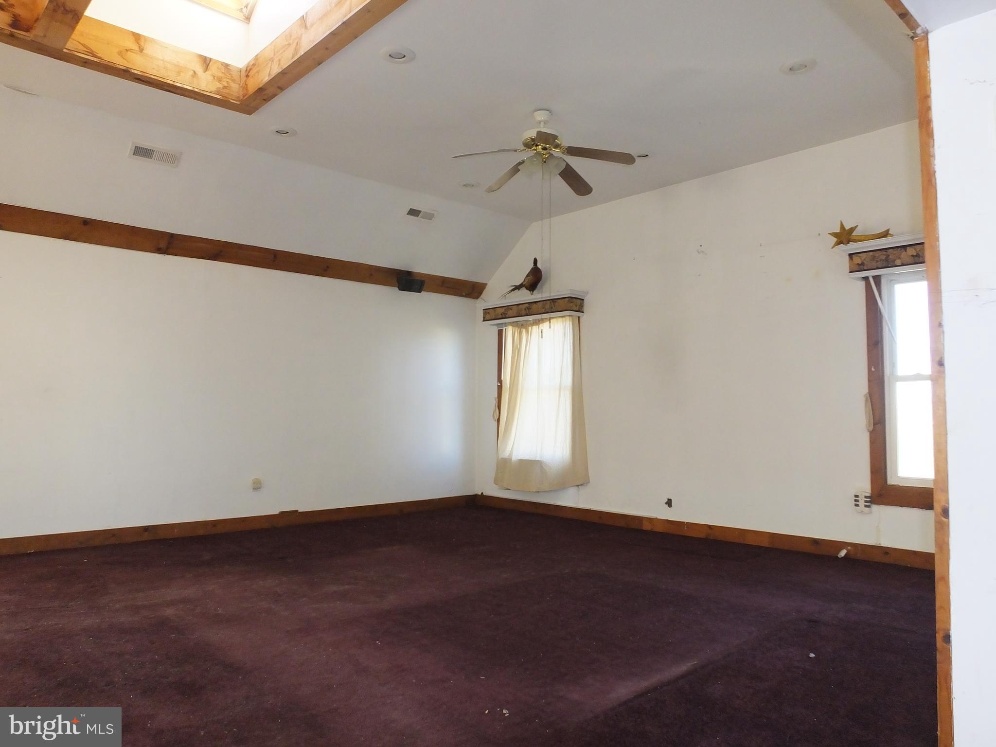 1213 Horse Point Road Fishing Creek, MD 21634 - Photo 13 of 23 an empty room with a window