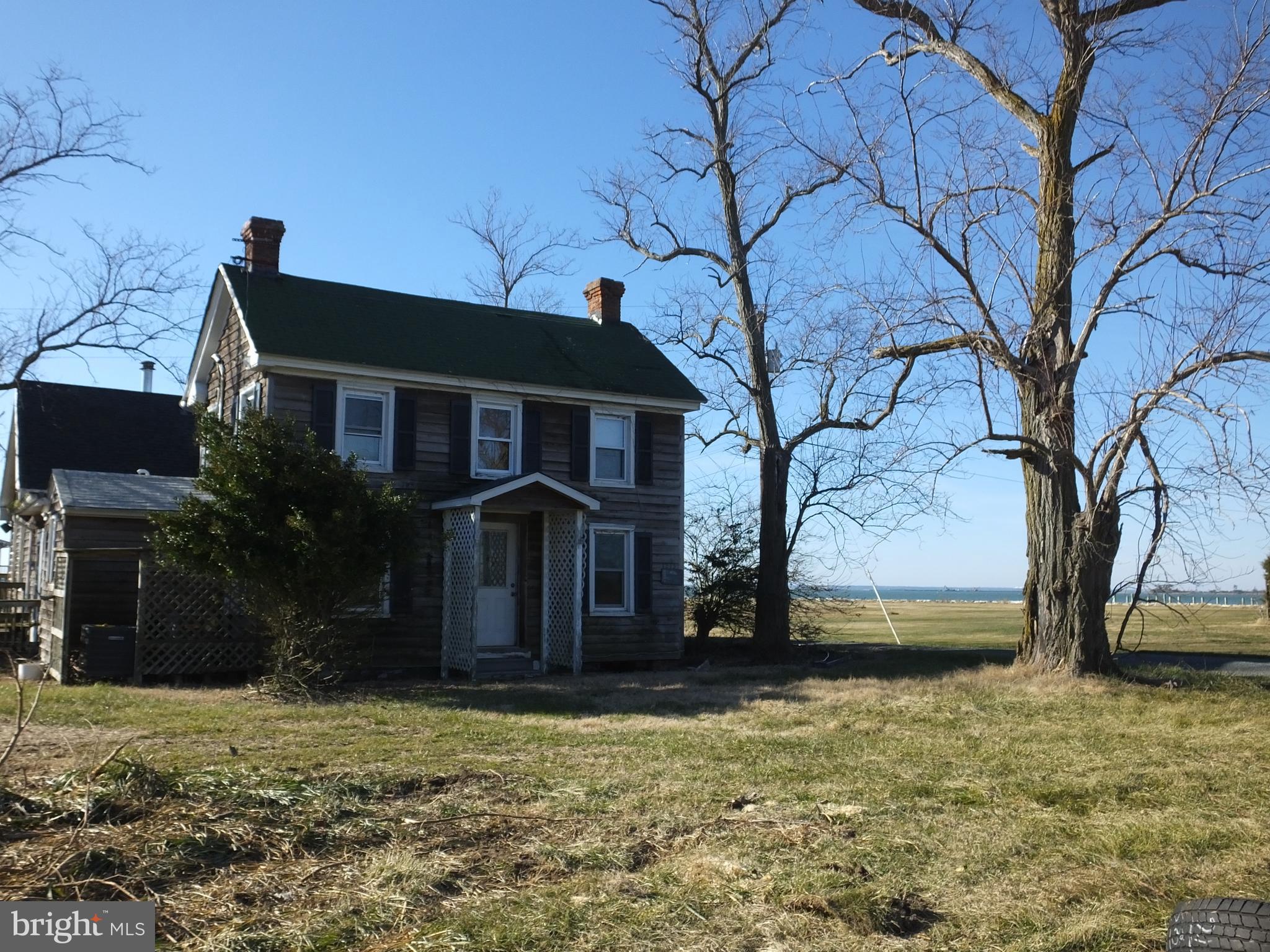 1213 Horse Point Road Fishing Creek, MD 21634 - Photo 2 of 23 a front view of house with yard