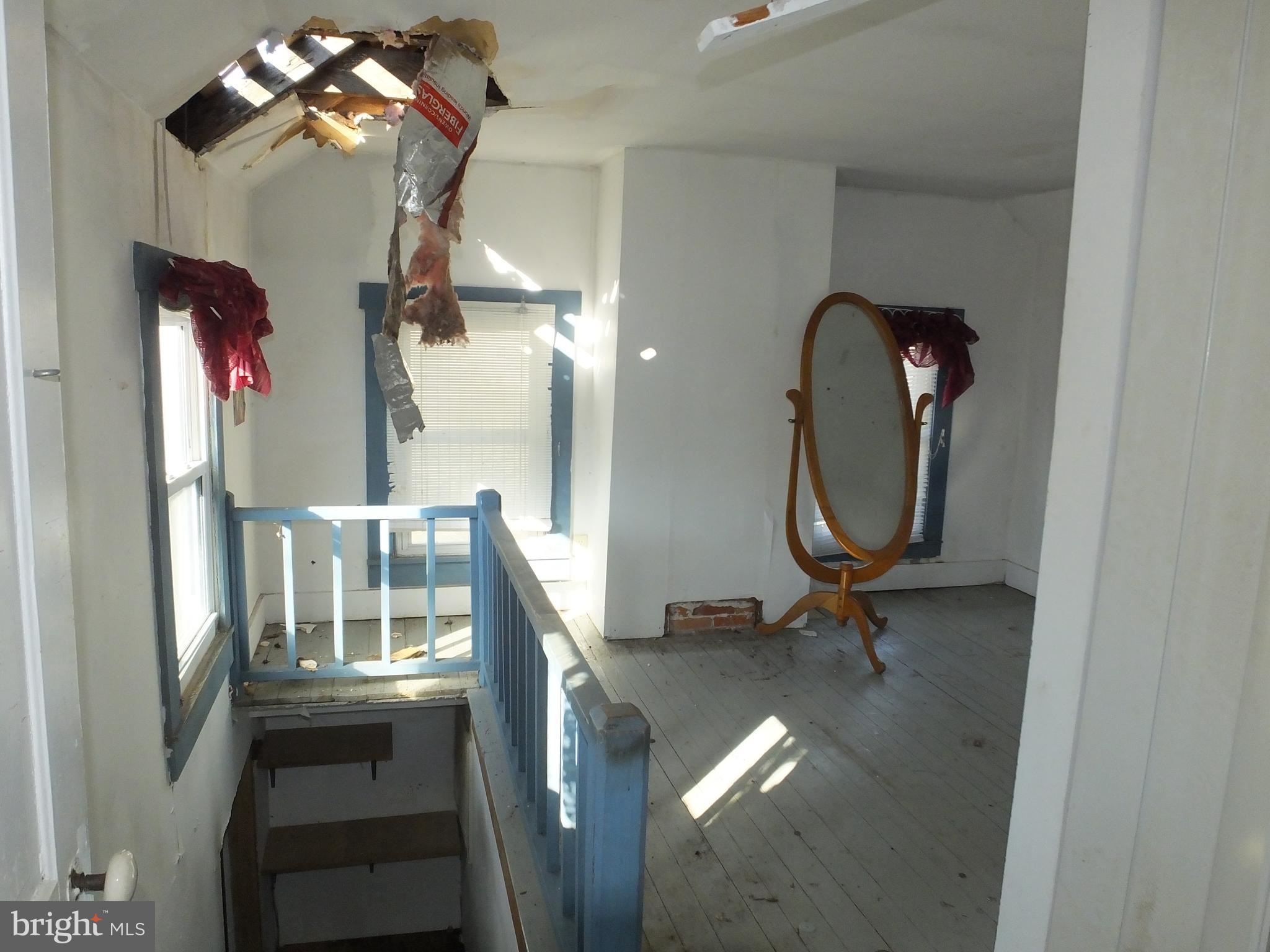 1213 Horse Point Road Fishing Creek, MD 21634 - Photo 22 of 23 a view of a room with a mirror and hardwood floor
