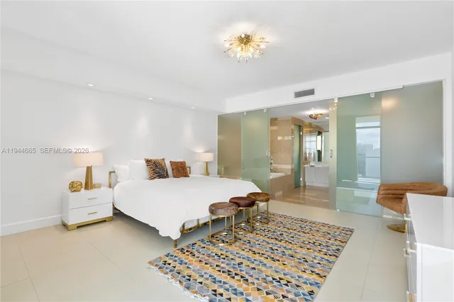 a bedroom with a bed and a table