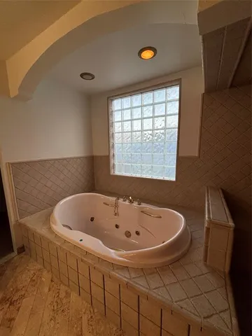 a bathroom with a sink double vanity and a mirror