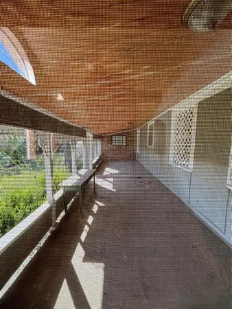 a living room with a fireplace and a rug